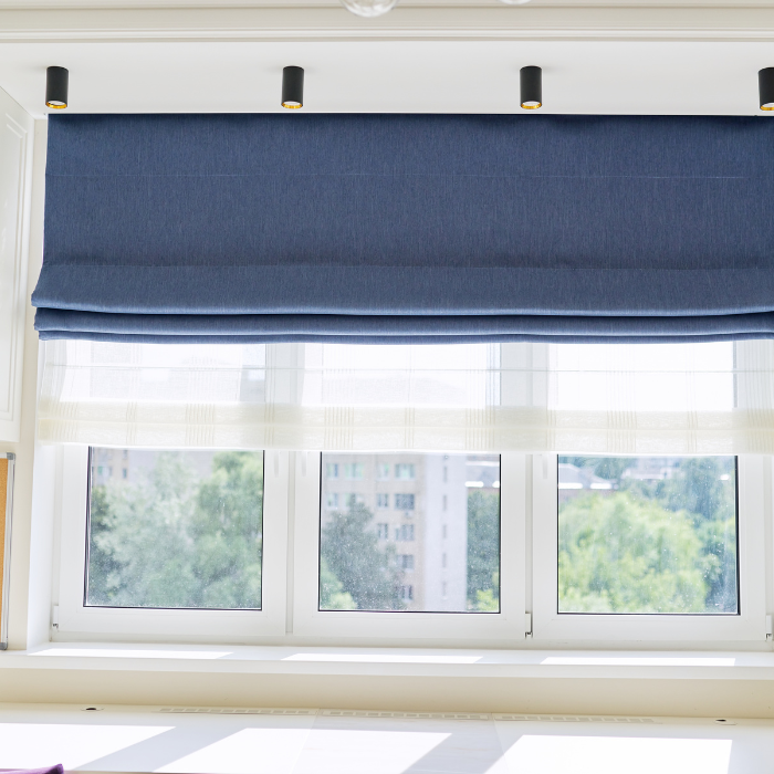 Roman blinds in window